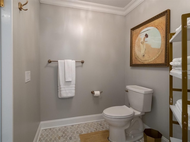 bathroom with tile patterned floors, toilet, and crown molding