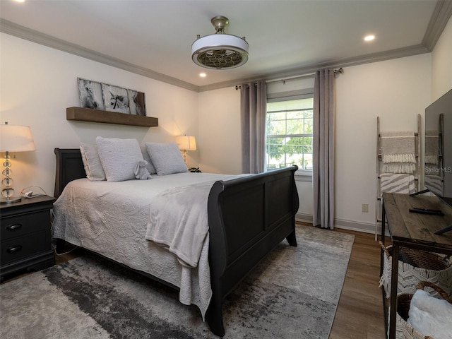 bedroom with dark wood-type flooring and ornamental molding