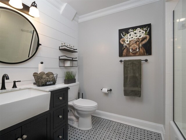 full bathroom featuring toilet, crown molding, tile patterned floors, enclosed tub / shower combo, and vanity