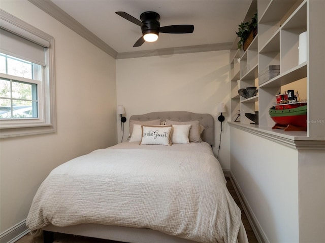 bedroom with ornamental molding and ceiling fan