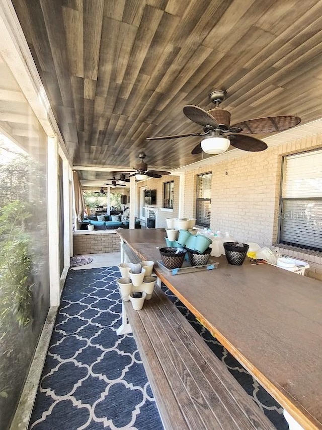 unfurnished sunroom featuring wood ceiling