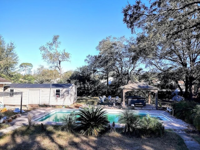 view of pool featuring a gazebo and a jacuzzi