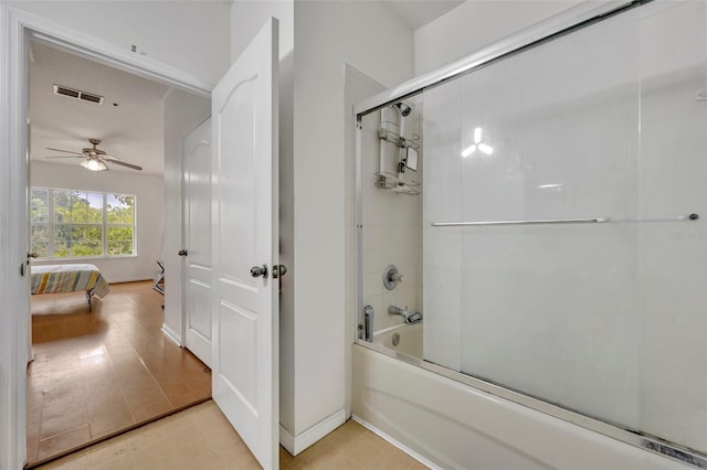 bathroom featuring shower / bath combination with glass door, tile patterned flooring, and ceiling fan