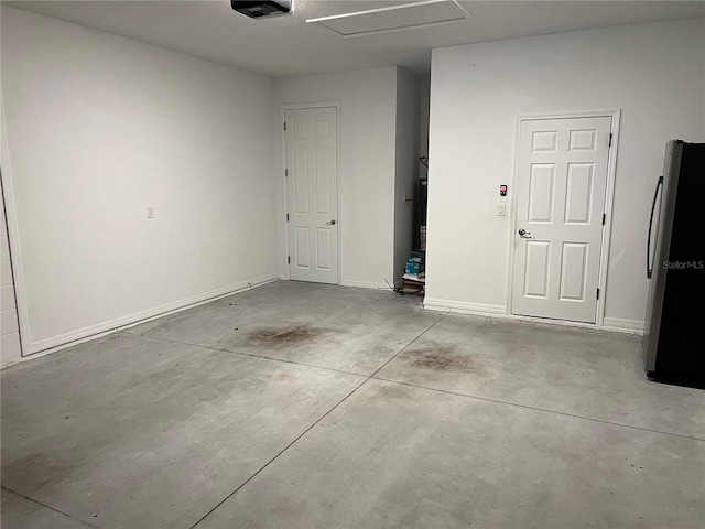 garage featuring stainless steel refrigerator