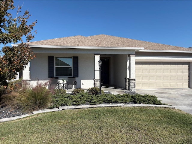 view of front of house featuring a front yard and a garage