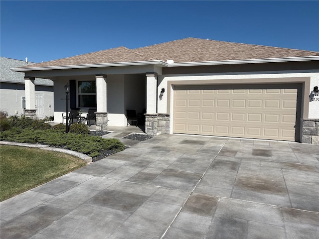 view of front of property featuring a porch and a garage