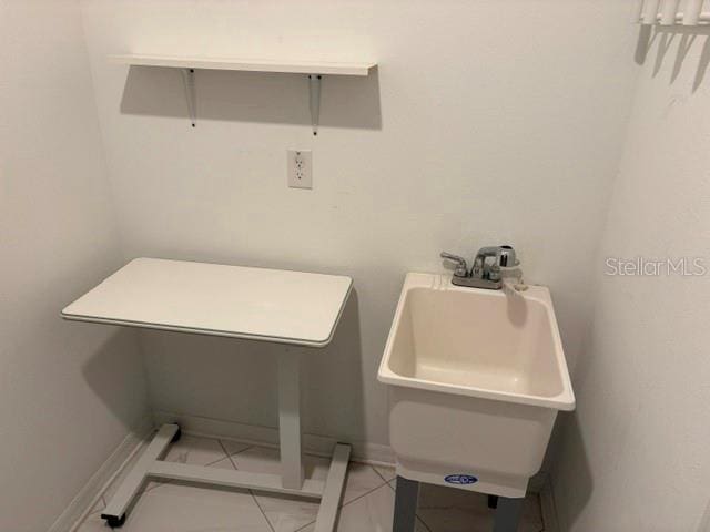 bathroom featuring tile patterned floors and sink