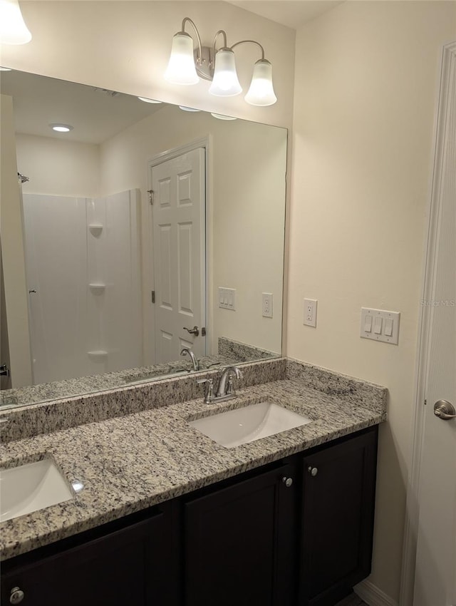 bathroom with dual bowl vanity