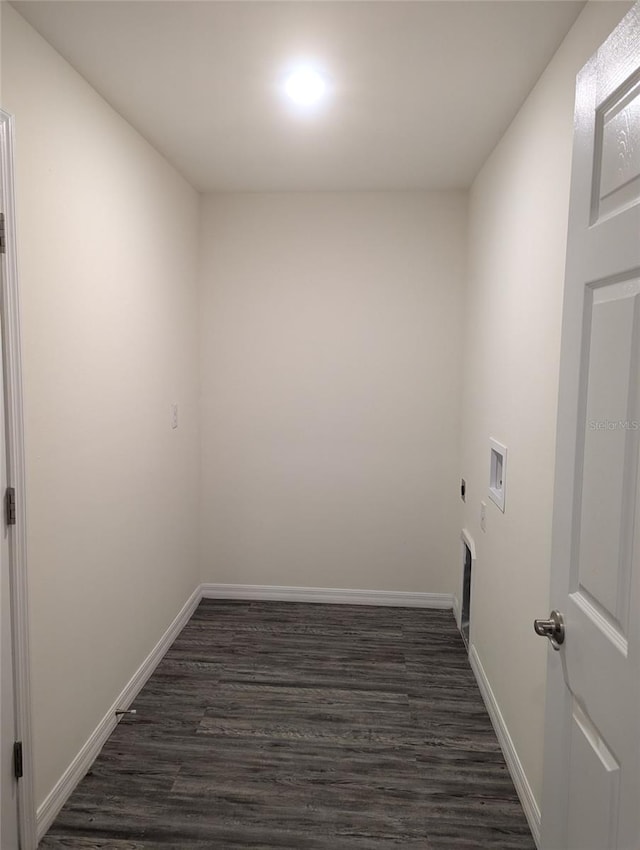 washroom with electric dryer hookup, dark hardwood / wood-style floors, and hookup for a washing machine