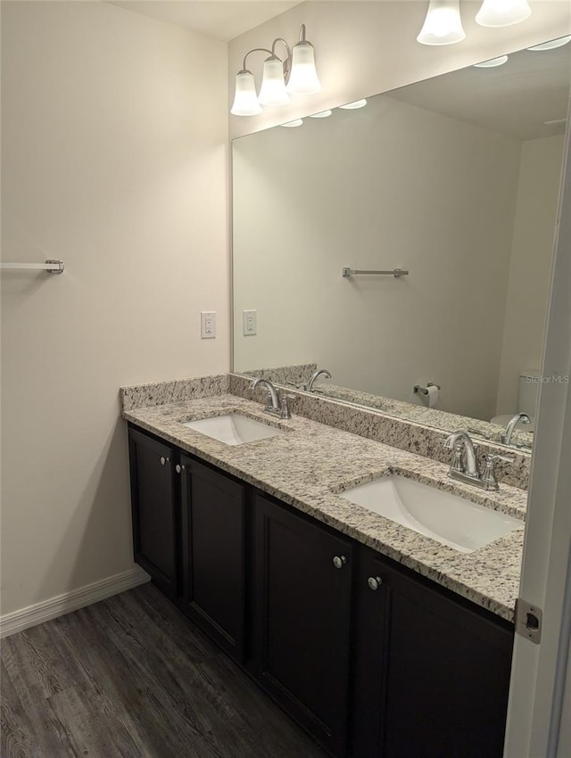 bathroom with vanity and hardwood / wood-style floors