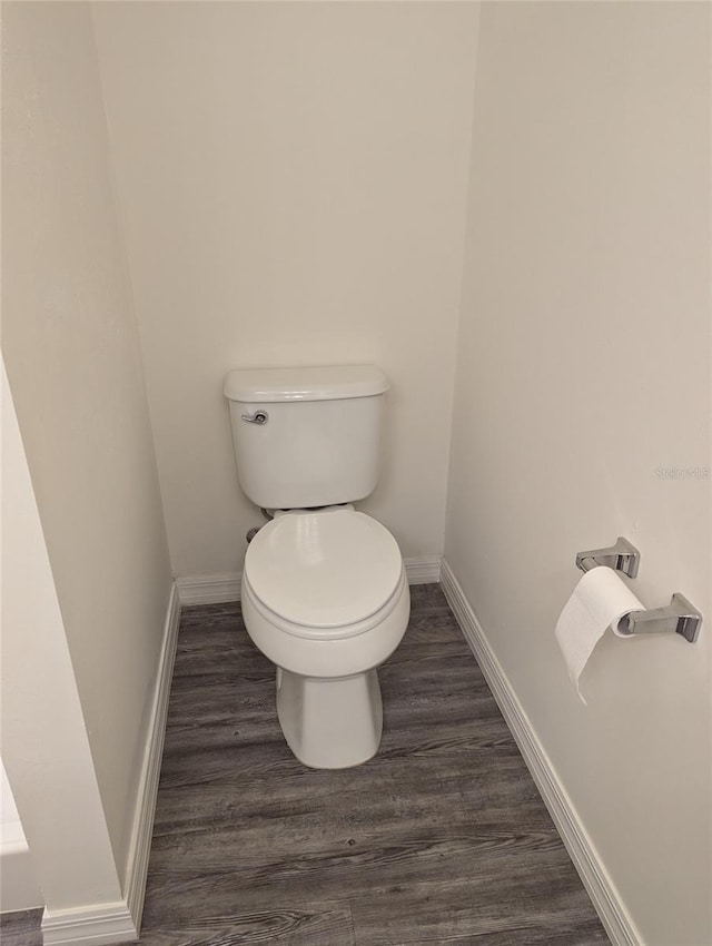 bathroom featuring toilet and hardwood / wood-style floors