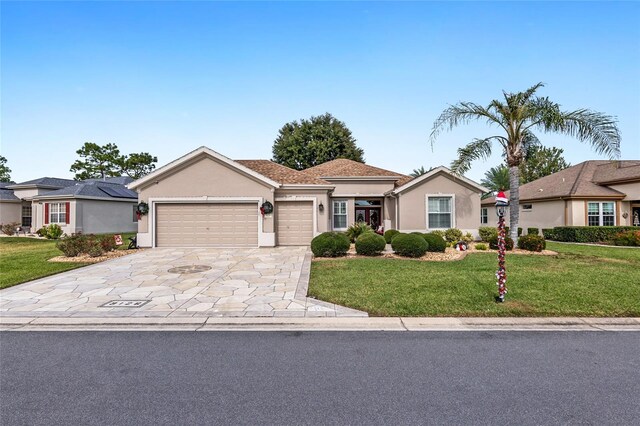 view of front of house with a front lawn and a garage