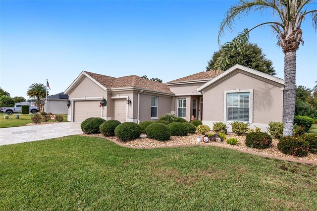 ranch-style home with a front lawn and a garage