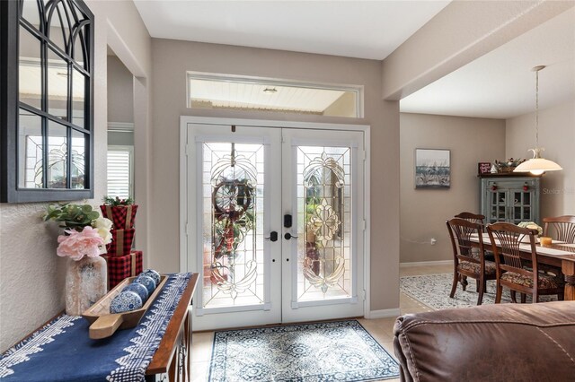 tiled entrance foyer with french doors