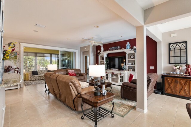 tiled living room with ceiling fan