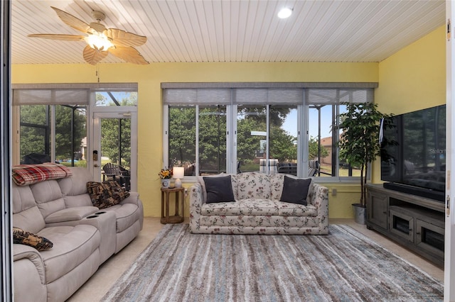 sunroom / solarium with wood ceiling and ceiling fan