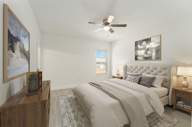 bedroom with ceiling fan and light wood-type flooring