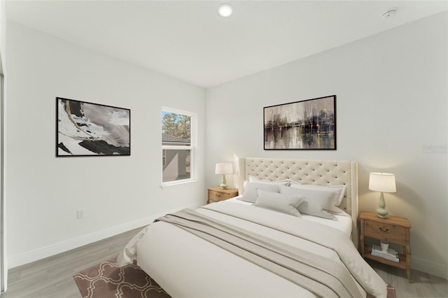 bedroom with hardwood / wood-style floors