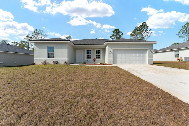 view of front of house with a garage, a front yard, and central AC