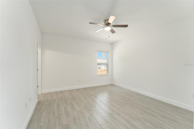 spare room with ceiling fan and light hardwood / wood-style floors