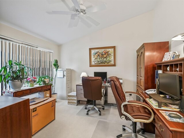 office with a ceiling fan and lofted ceiling