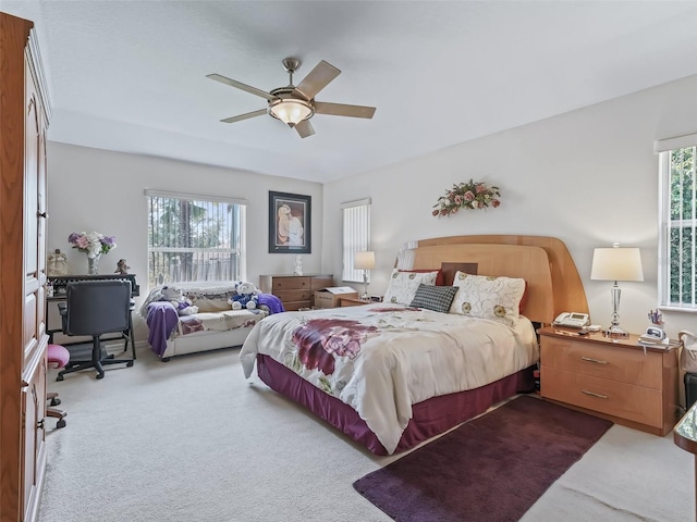 carpeted bedroom with a ceiling fan