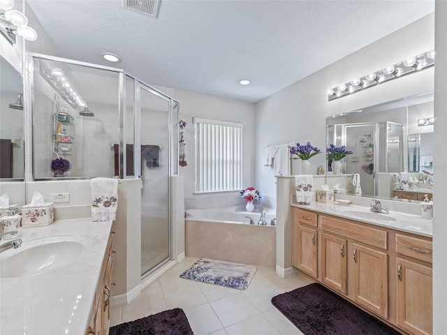 bathroom with a stall shower, visible vents, a sink, and a bath