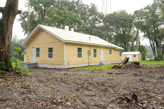 exterior space featuring a shed