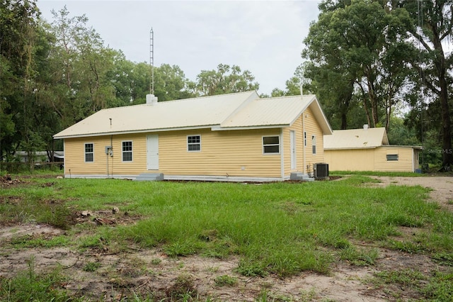 back of property featuring central AC unit