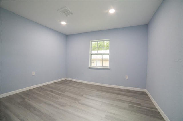 unfurnished room featuring hardwood / wood-style floors