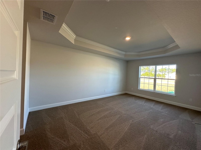 unfurnished room with carpet floors, crown molding, and a tray ceiling