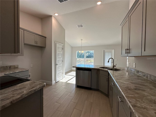 kitchen featuring dishwasher, sink, light hardwood / wood-style floors, lofted ceiling, and decorative light fixtures