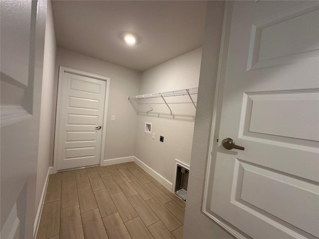 laundry area featuring electric dryer hookup, light wood-type flooring, and hookup for a washing machine