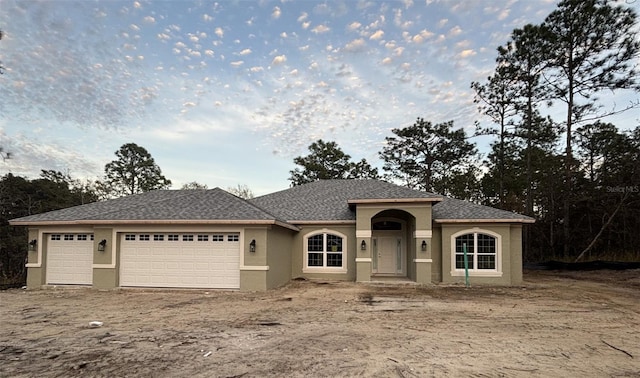 view of front of home with a garage