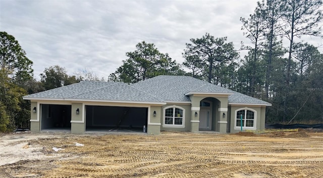 ranch-style home with a garage