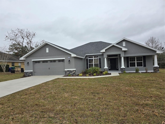 craftsman-style home featuring a garage and a front yard