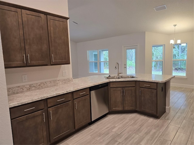 kitchen with dark brown cabinetry, sink, stainless steel dishwasher, and kitchen peninsula