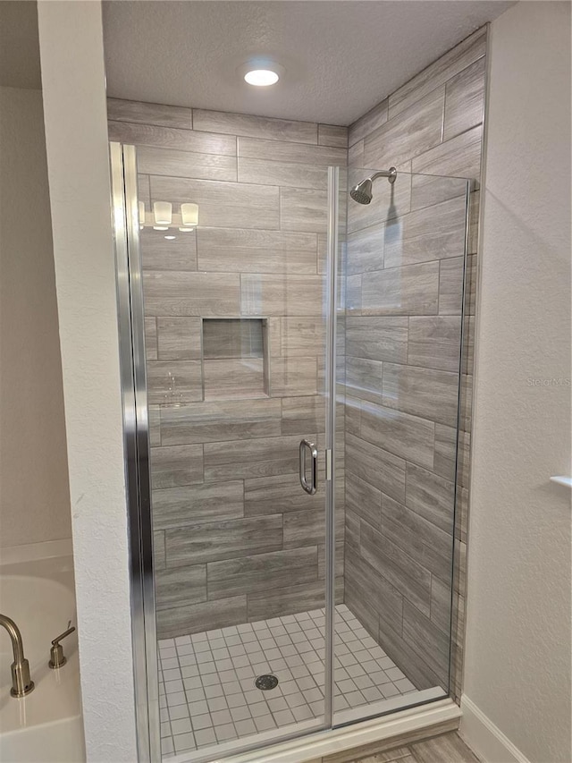 bathroom with an enclosed shower