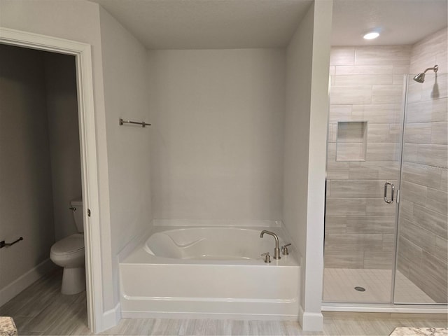 bathroom with plus walk in shower and toilet