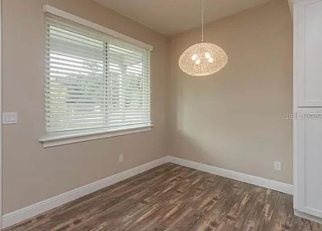 0 Fisher Lane Way, Ocklawaha, FL 32179 - unfurnished dining area with dark wood-style floors and baseboards