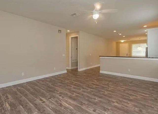 0 Fisher Lane Way, Ocklawaha, FL 32179 - unfurnished living room with dark wood finished floors, a ceiling fan, recessed lighting, and baseboards