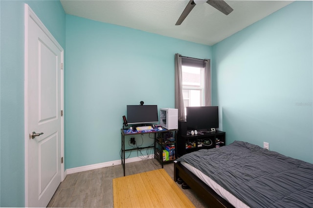 bedroom featuring ceiling fan and wood-type flooring