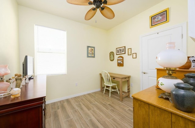 office area with ceiling fan and light hardwood / wood-style flooring