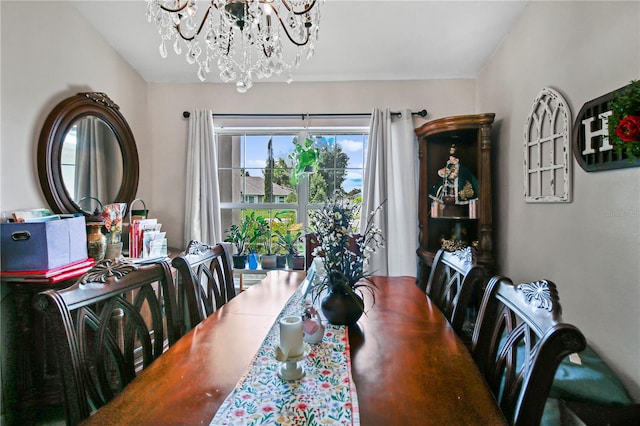 dining area featuring a notable chandelier