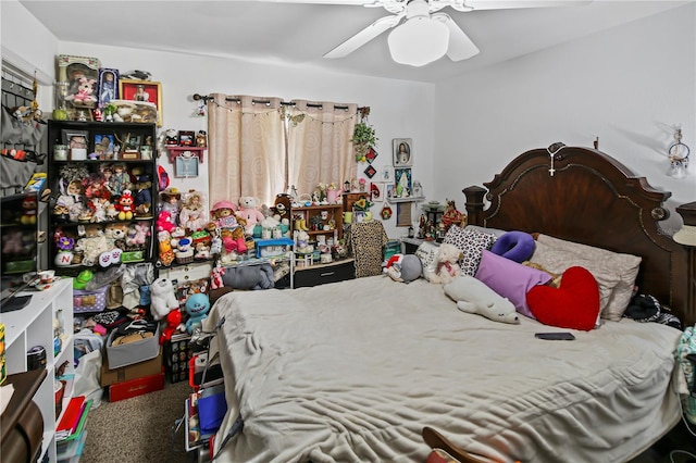 bedroom featuring ceiling fan and carpet