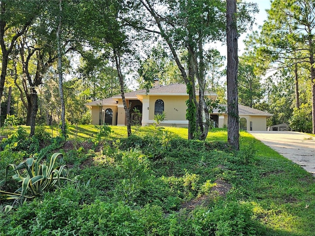 ranch-style home with stucco siding