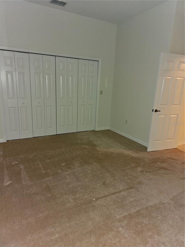 unfurnished bedroom with carpet floors