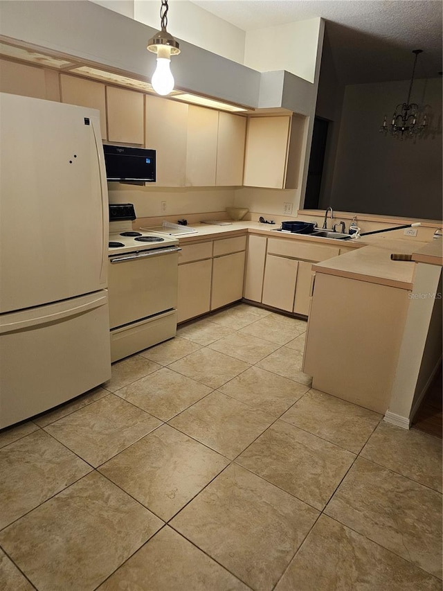 kitchen with white appliances, hanging light fixtures, light tile patterned floors, sink, and kitchen peninsula