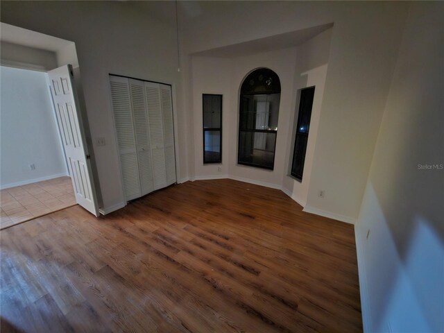 unfurnished room with hardwood / wood-style floors