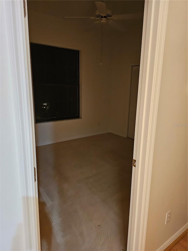 unfurnished room featuring light colored carpet